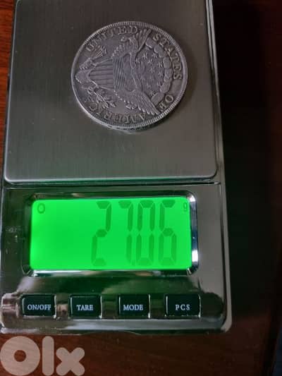 A silver old coin 15 dollars the gram