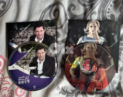 two cds original with no cover : zein el omor& amal hijazi both 5 $