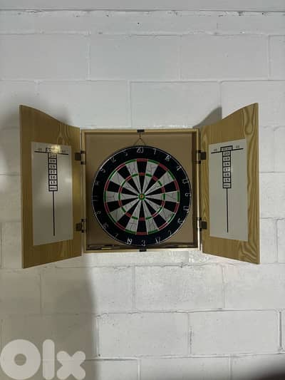 dart board with wood house