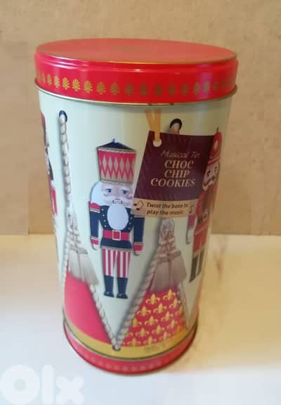 Christmas deco. Rotating musical tin biscuit box nutcracker 22cm