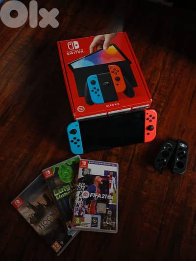 Nintendo switch oled with 3 video games plus all accessories