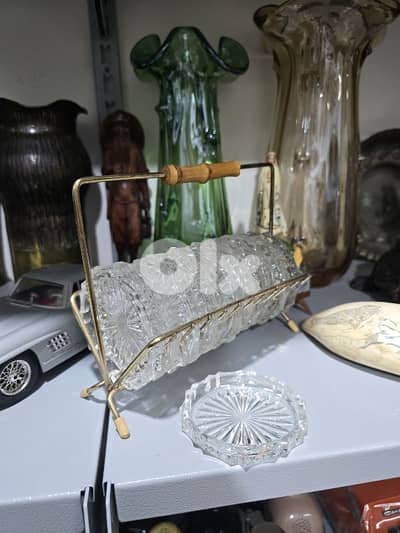 vintage crystal coasters in a brass rack