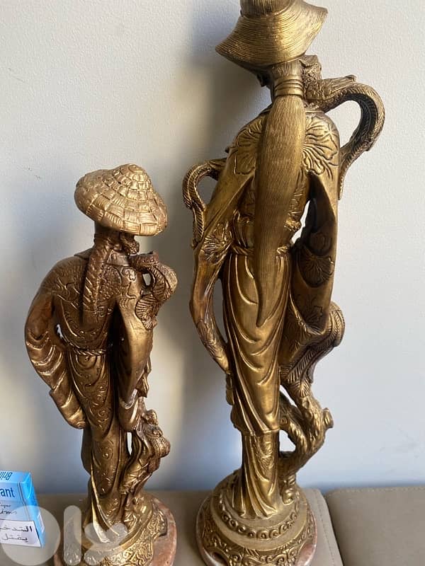 Two resin old statues . 51 cm. 41 cm. 4
