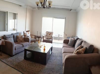 Living room sofas, tables, carpet and chadelier