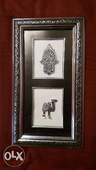 hand of fatima and tree and camels