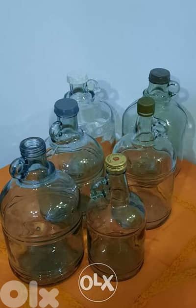 Glass galons. sizes:small 24cm,medium 27cm,L 31cm,XL 33cm غالون زجاج